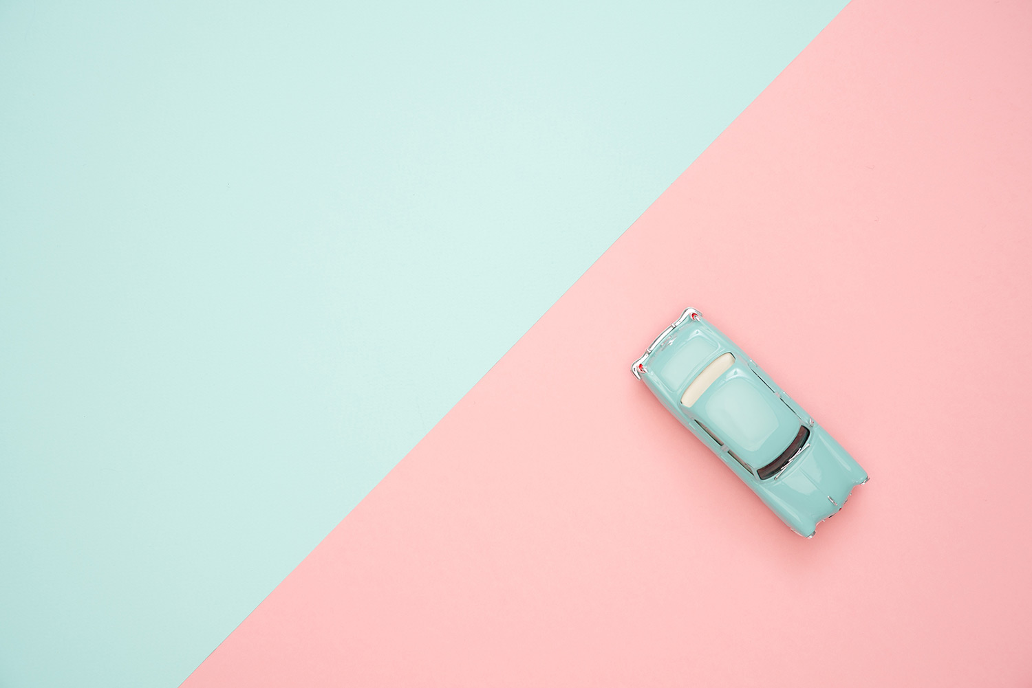 blue car on pink and blue background